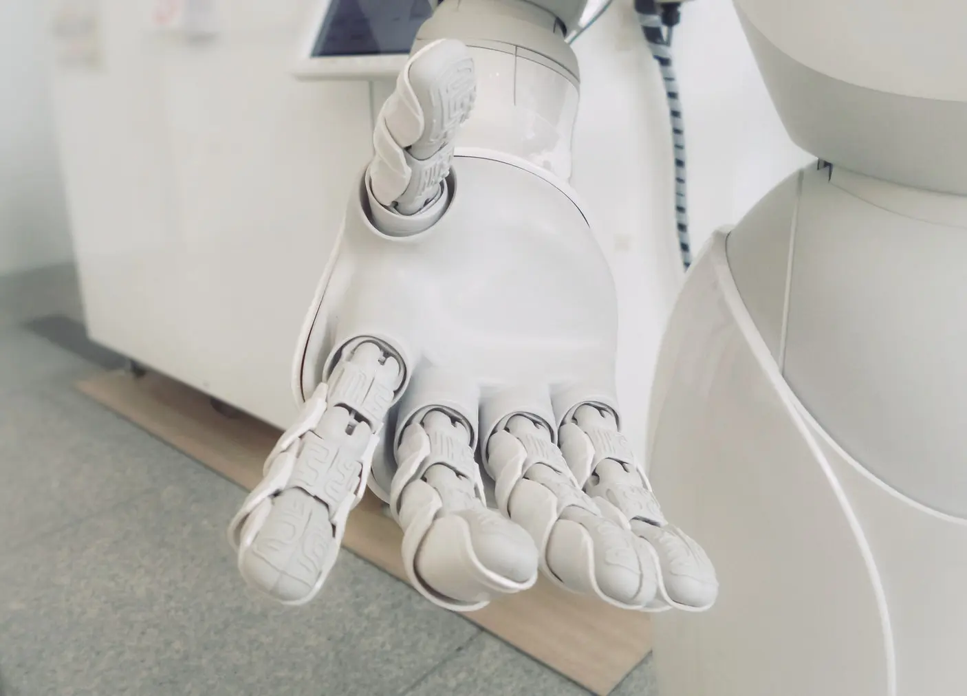 A robot hand reaching towards the camera